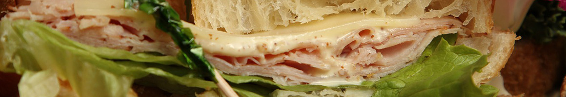 Eating Deli Sandwich at Midtown Deli restaurant in Post Falls, ID.